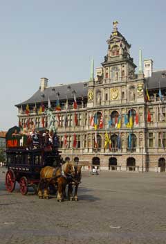 An horse drawn tram leaves from the Town Hall for a tour of the historic centre