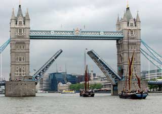 Tower bridge opens for two Thames barges