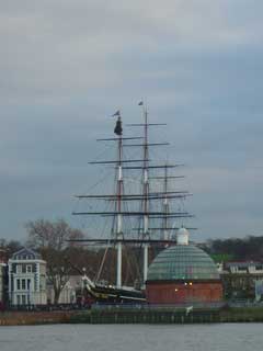 The Cutty Sark celebrates Christmas by hoisting a tree up the mast