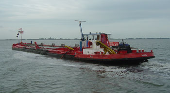 A dredger keeps the channel across the Waddenzee clear