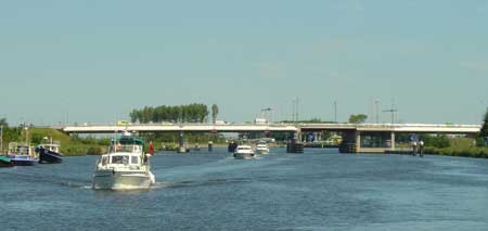 The Broom Owners fleet makes its way under the Buitenhuizen brug on Zeekanal C