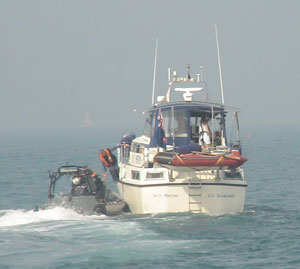 Customs officers leave the boat empty handed after a comprehensive search