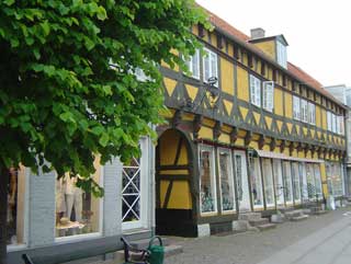 Picturesque half-timbered buildings line Koge's main street