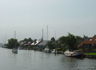 The Zijlroede channel  into Lemmer is lined with riverside houses and bungalow parks