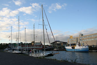 Yachts moor to the quay next to the restaurant ship 't Schip